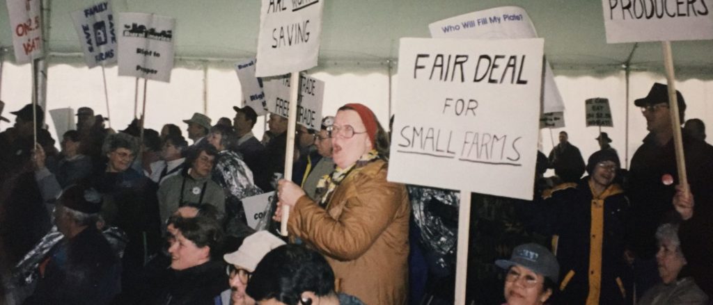 Group of individuals holding signs protesting